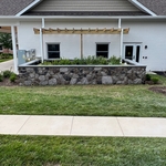 Wall wrapped in stone