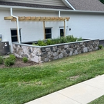 Wall wrapped in stone