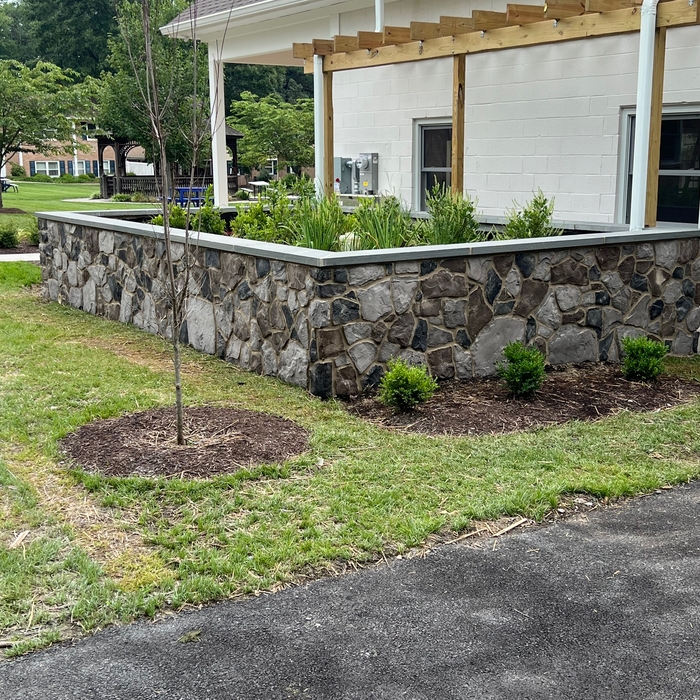 Wall wrapped in stone