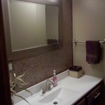 Refinished oak vanity, custom onyx countertop, 1x1 glass tile backsplash/mirror wall