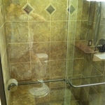 completely custom tile shower built from studs up, new shower pan, 2x2 tile floor, built in bench, diamond tile inlays, fixtures, glass doors