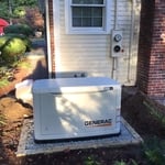 Standby Generator installed in the back of family's home.