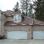 Gutter Helmet on Brown Tile Roof