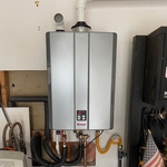 moved heater location from inside house to garage. Roughed in new water lines, gas line and vent lines for new location.