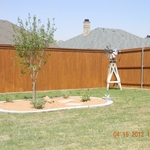 Fence with Stain/Concrete Curbing