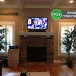 TV mounted over fire place.