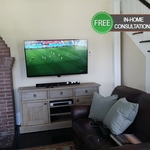 TV mounted on wall.