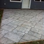 Light grey slate decorative stamped concrete before sealer.