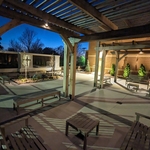 A view of the 100 niche inurnment feature from under the pergola at night