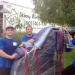 Jeff, Eddie and Luke moving a baby grand piano.