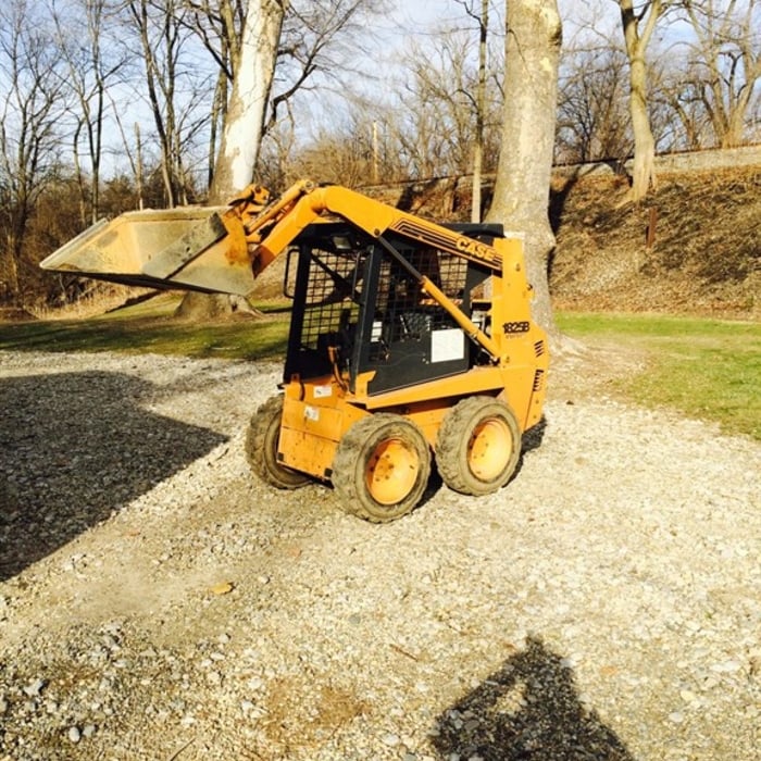 skid loader to move stone debris