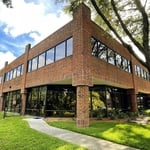 This image showcases the expert window film installation by Precision Safety Films at a professional office building, in order to enhance daytime privacy and energy efficiency without compromising on aesthetics.