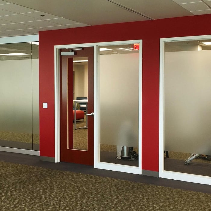 Frosted window film installed on office windows in order to create private spaces within a workplace.