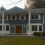 James Hardie Siding Color: Booth Bay Blue, custom raised panels on bay windows using Cellular PVC Trim, Custom Columns with square recessed trim