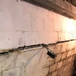 Buckling, severely bowing wall