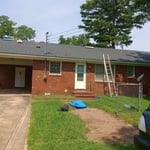 Completed rear of single story home using architect style shingles.