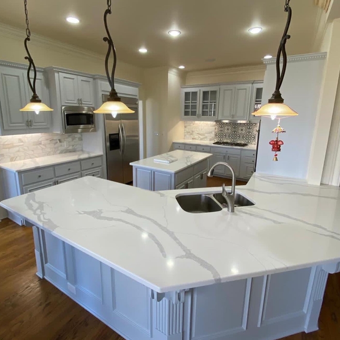 Before and after remodeling, with raised bar top cuted down to make à soled pieces of countertops