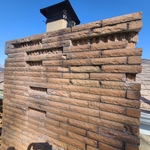 Bricks cut out to replace. This is the proper way of replacing damaged bricks. Some use mortar to cover the damage, or stone veneer without fixing the actual problem. If your bricks are damaged, request that they be cut out and replaced completely. If your mason says it can't or won't do it, look for another mason!
