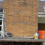 Unfortunately finding a perfect match for the brick can be difficult. In this case the original bricks are stone face 11 1/2". There were no 11 1/2" stone face bricks that were a close match so the customer chose bark face bricks of the same color. It's not a perfect match but with time and weathering the color will be identical.