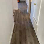 Complete vinyl flooring in hallway.