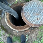 This is me running a snake through a clean out that was on the outside of this customers home