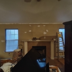 Damage to wall above fireplace repaired