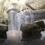 Original cast iron soil pipe corroding from the inside out.