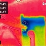 The thermal camera lets the inspector see that as refrigerant line enters the furnace coil area, there's a weak spot in the system that needs repair.