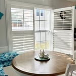 Interior Plantation Shutters open for easy access to window .