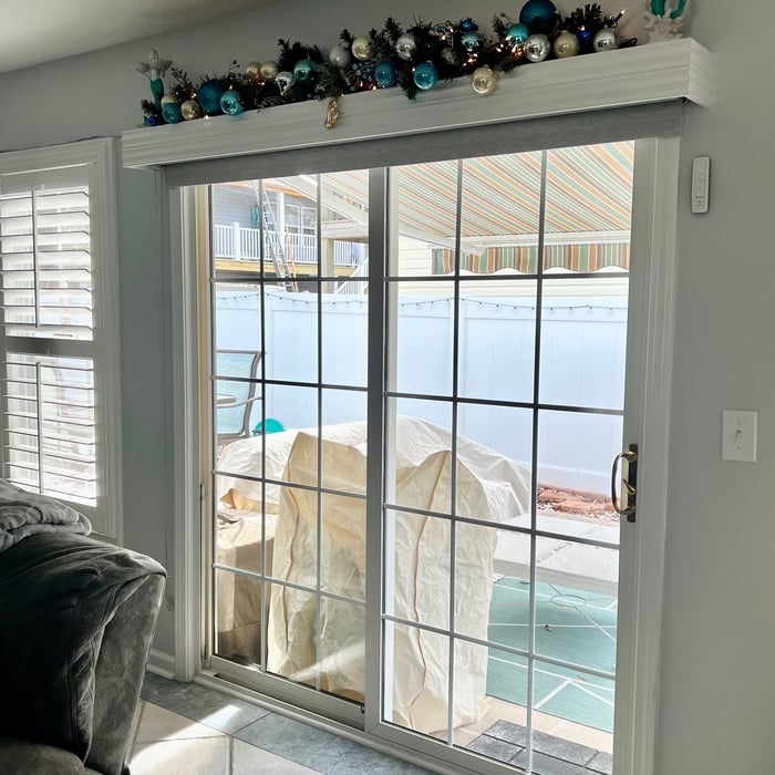 Custom made Cornice for over sliding doors in living room .