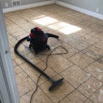 Removal of old carpet & floor prep in bedroom #1.