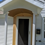 New front door and new roof system with a radius ceiling