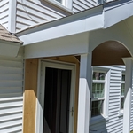 New overhang above front door of the house with a barrel ceiling