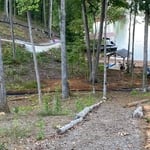 Adding landscape fabric, and also staples
