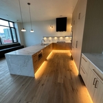 Quartzite Kitchen and Shelves with Waterfall Edge