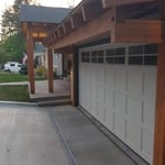 Timber cover and 30” lift on garage. This garage was only 7’ tall and we cut the roof free and raised it to accommodate a 8’ tall door. Finished off with 4’ of Timber cover to tie in the entry.