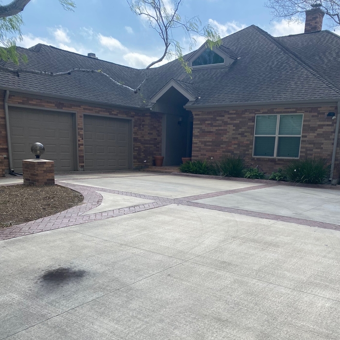 Tire marks and tree sap disrupting this beautiful homes curb appeal.