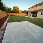 Paver Patio & New Sod with a small retaining wall.