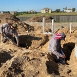 Installation of sewer under slab.