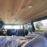Installed wood panels to create ceiling for a van build