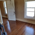 Floor stained panels up trim on waiting second coat and seal