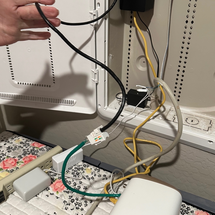 Here you can see the black CAT6 line I installed for the customer. Then COX was supposed to physically move the device to the office were I installed the new CAT6 Ethernet line.