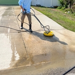 Using scrubber to clean driveway safely after applying product
