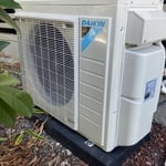 Completed installation of a Daikin outdoor condenser