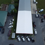 Partial Silicone Sealant Installation on Metal Roof.