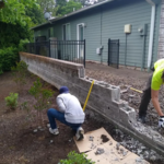 This is the brick wall the customer requested to be removed, near the beginning of the removal process.