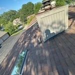 Before: Warped wood and shingles have damage.