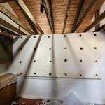 The wall to wall mirror was tar/glued to the wall and was very carefully cut away and demolished safely.