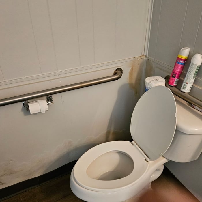 Water damaged paneled walls need demolition and remodel.