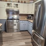 Painting and laminate flooring in kitchen and breakfast nook